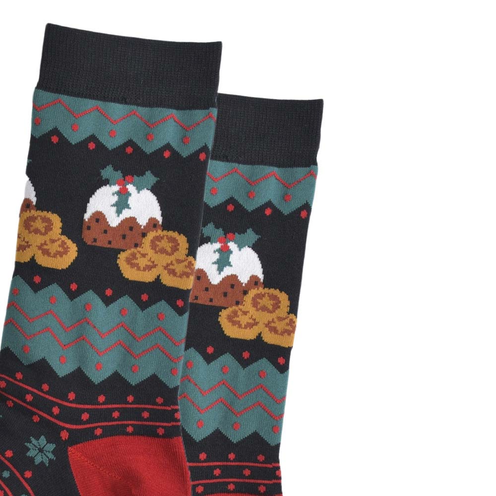 Close-up of a pair of men's black socks featuring Christmas puddings and mince pies along with red and green zig-zags and stripes
