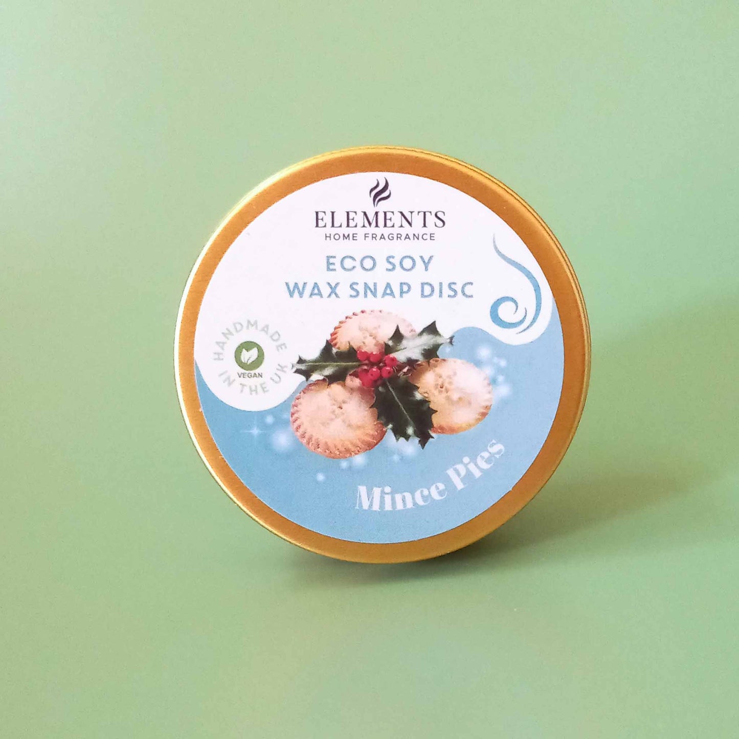 A round metal tin containing a mince pie scented wax melt snap disc