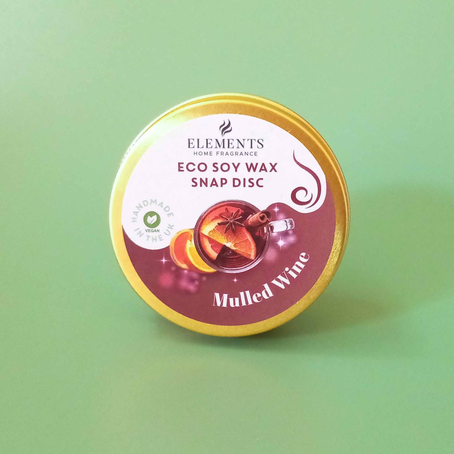 A round metal tin containing a mulled wine scented wax melt snap disc