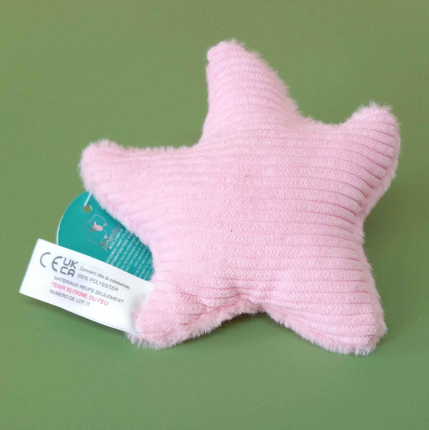 Back of pink starfish soft toy showing corduroy backing