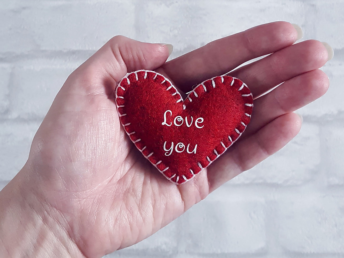 Red felt heart shaped pocket hug with love you text