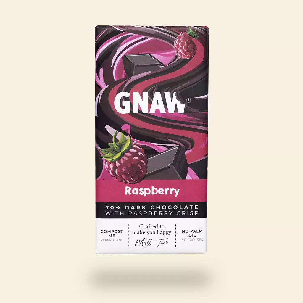 GNAW Raspberry dark chocolate bar packaging on a beige background