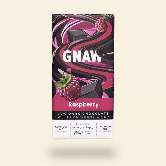 GNAW Raspberry dark chocolate bar packaging on a beige background