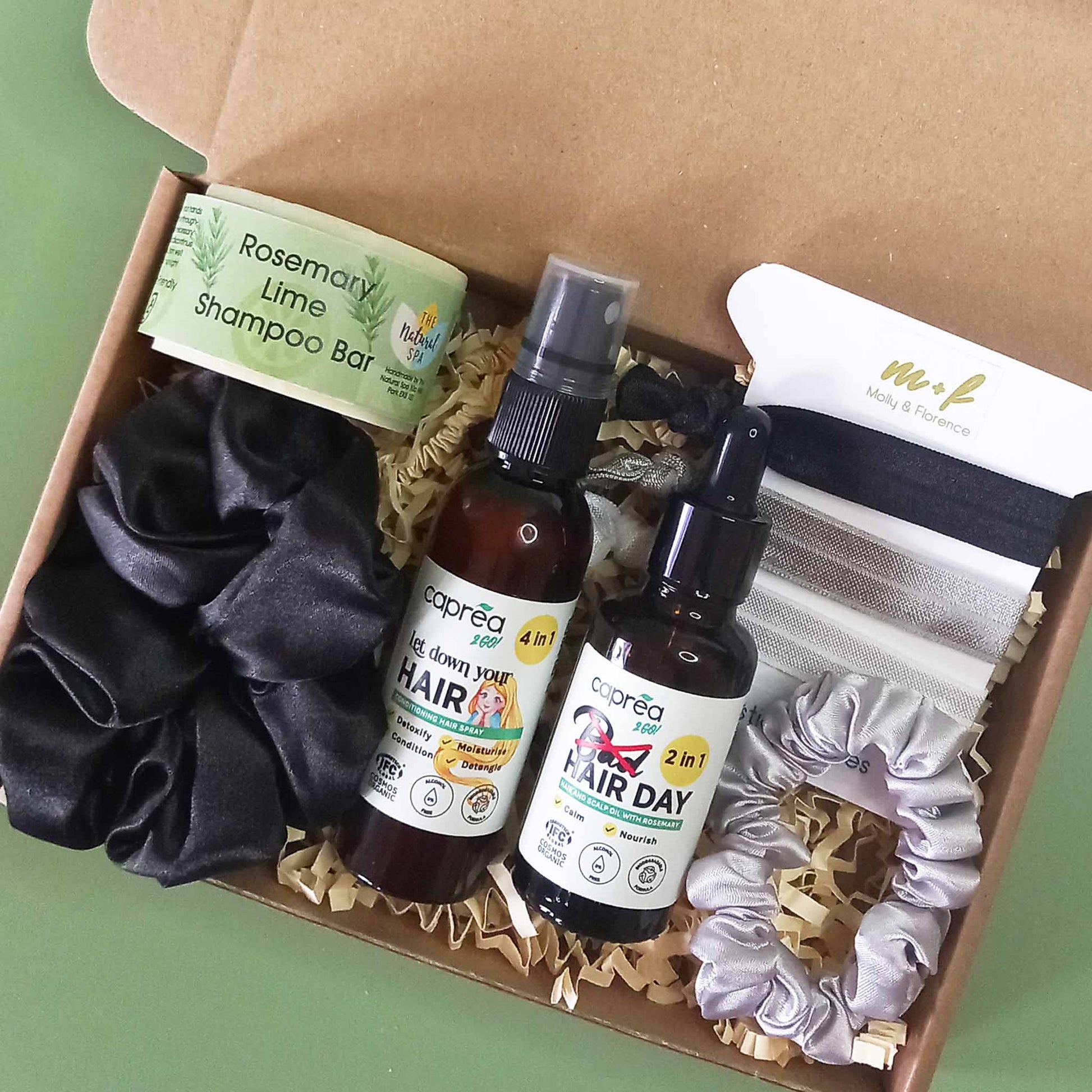 Hair care gift set including shampoo bar, leave is conditioner, hair and scalp oil, elastic hair ties and hair scrunchies