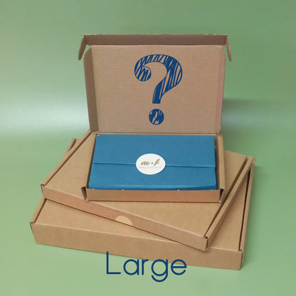 A stack of mystery gift boxes depicting the word large
