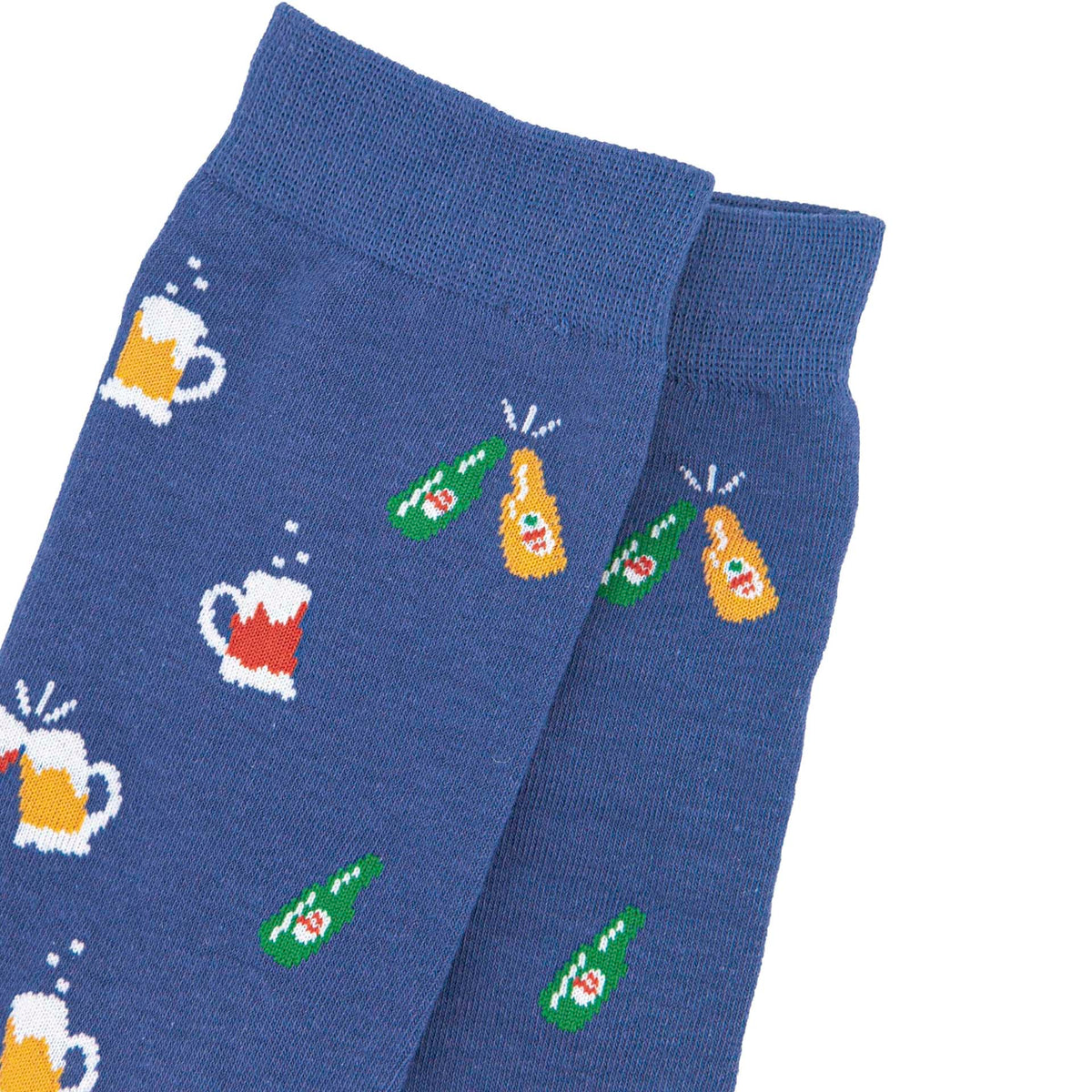 Closeup of a pair of blue socks with a pattern of clinking beer glasses and bottles, photographed on a clean white background.