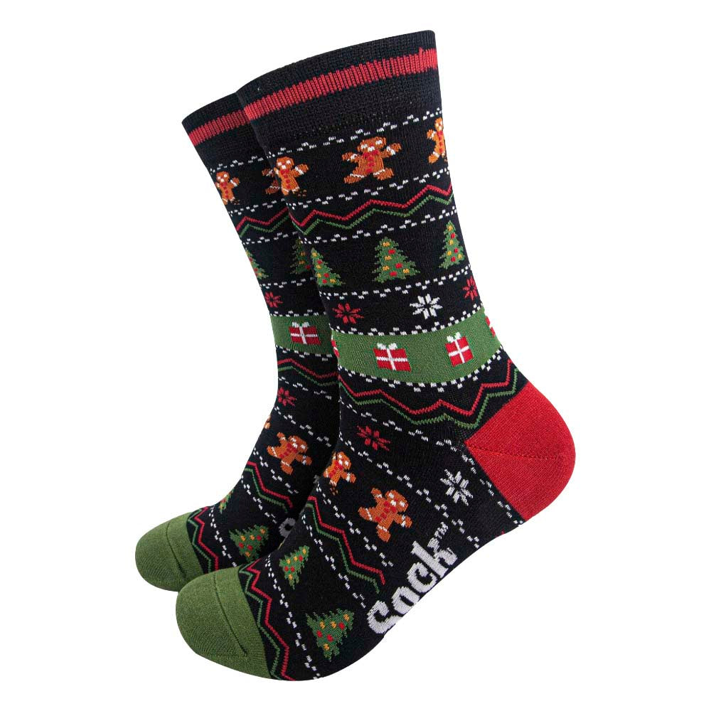 Black Fair Isle style socks featuring Christmas trees, gingerbread men, gifts and snowflakes. With green toes and red heels