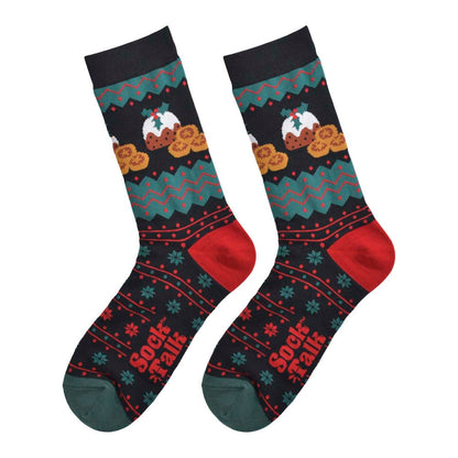 A pair of black socks featuring festive red and green patterns and pictures of Christmas puddings and mince pies. With red heels and green toes