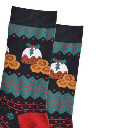 Close-up of a pair of men's black socks featuring Christmas puddings and mince pies along with red and green zig-zags and stripes