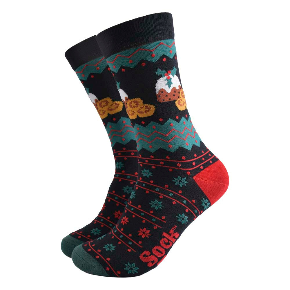 A pair of black socks featuring festive red and green patterns and pictures of Christmas puddings and mince pies