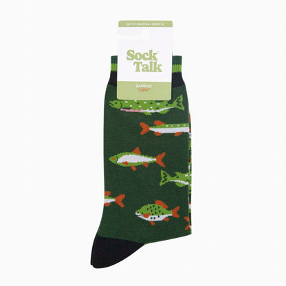 A pair of green bamboo fish themed socks with white, orange and black accents. Packaged on a card hanger featuring the Sock Talk branding