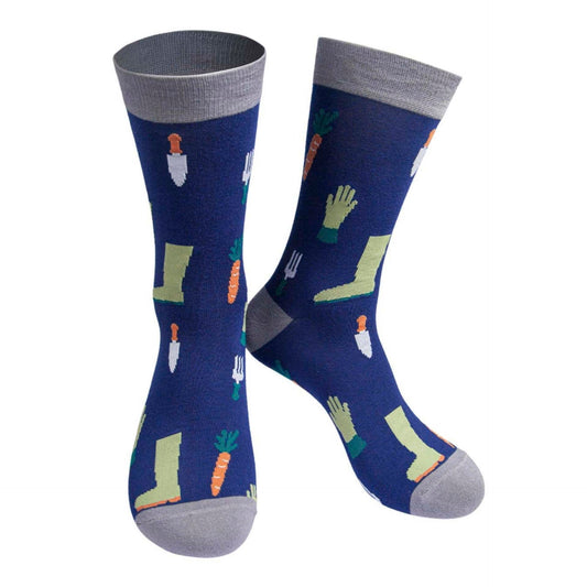 A pair of men's blue socks with grey toes, heels, and cuffs, featuring a pattern of gardening tools and carrots.
