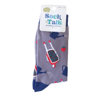 A pair of grey men's gardening themed socks packaged on a white card hanger with the Sock Talk branding