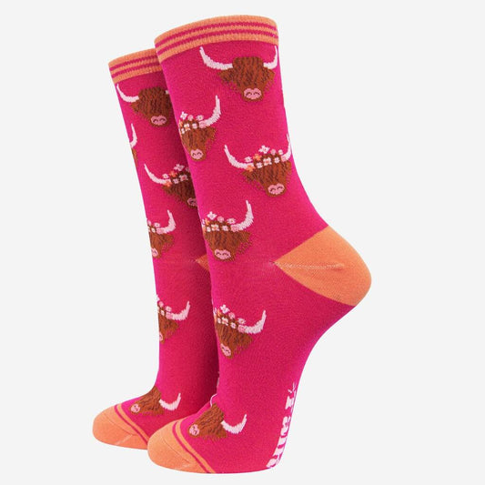 Cerise pink socks with highland cows heads design