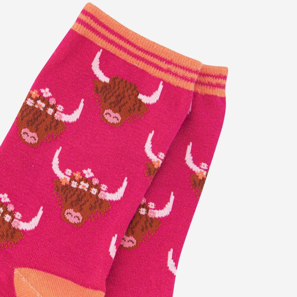 Close up detail of highland cow motif on pink socks