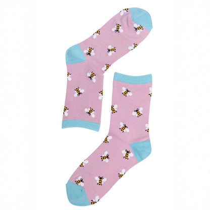 Pink socks with bee pattern and blue toes and cuffs on a white background