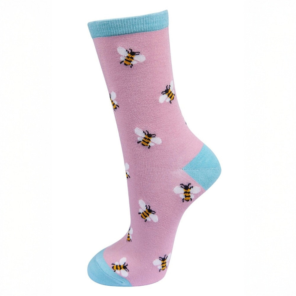 Pink sock with bee pattern and light blue accents on a white background