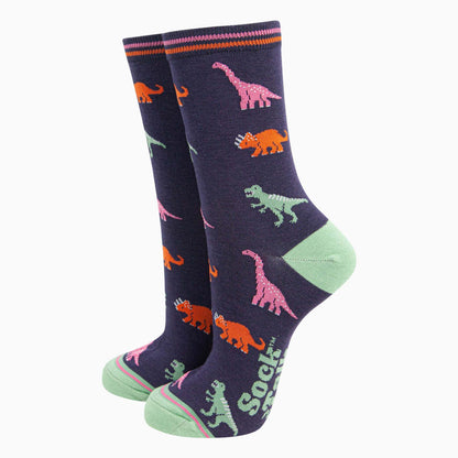 Pair of navy socks with colourful dinosaur pattern on a white background