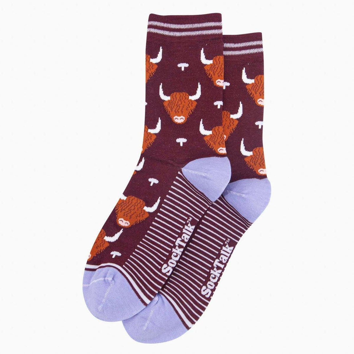 A pair of crew socks with a burgundy and orange highland cow pattern, featuring light purple toes and heels, and the brand name 'SockTalk' printed on the sole.