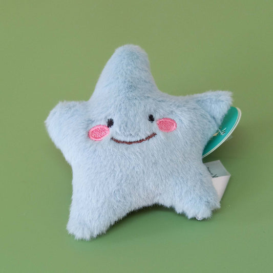 Blue faux fur starfish soft toy with smiling face