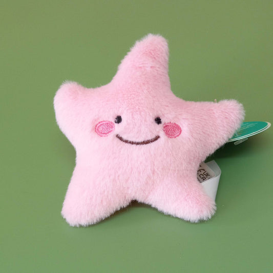 Pink faux fur starfish soft toy with smiley face